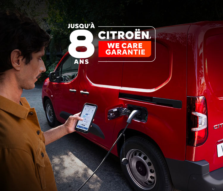 Man charging his red new ë-Berlingo Van