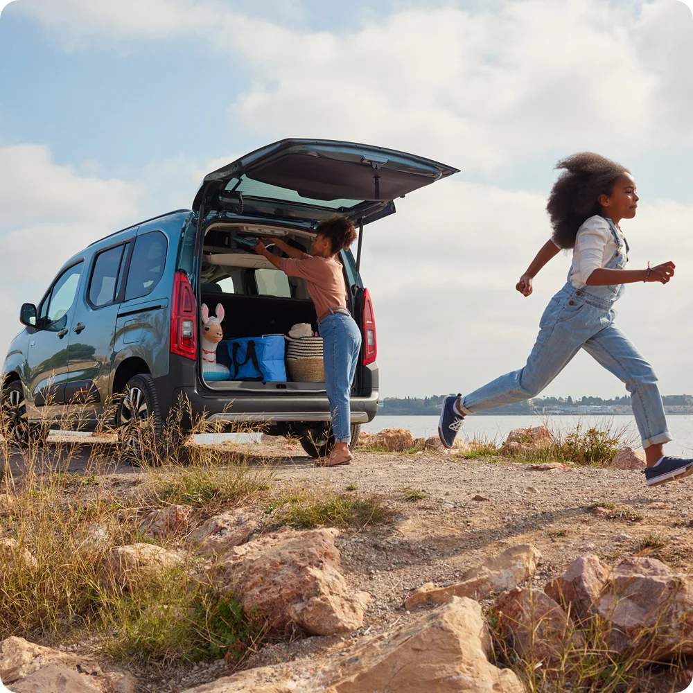 Rear view Kiama Blue ë‑Berlingo with open boot showing space, practicality, safety and confident versatile family use