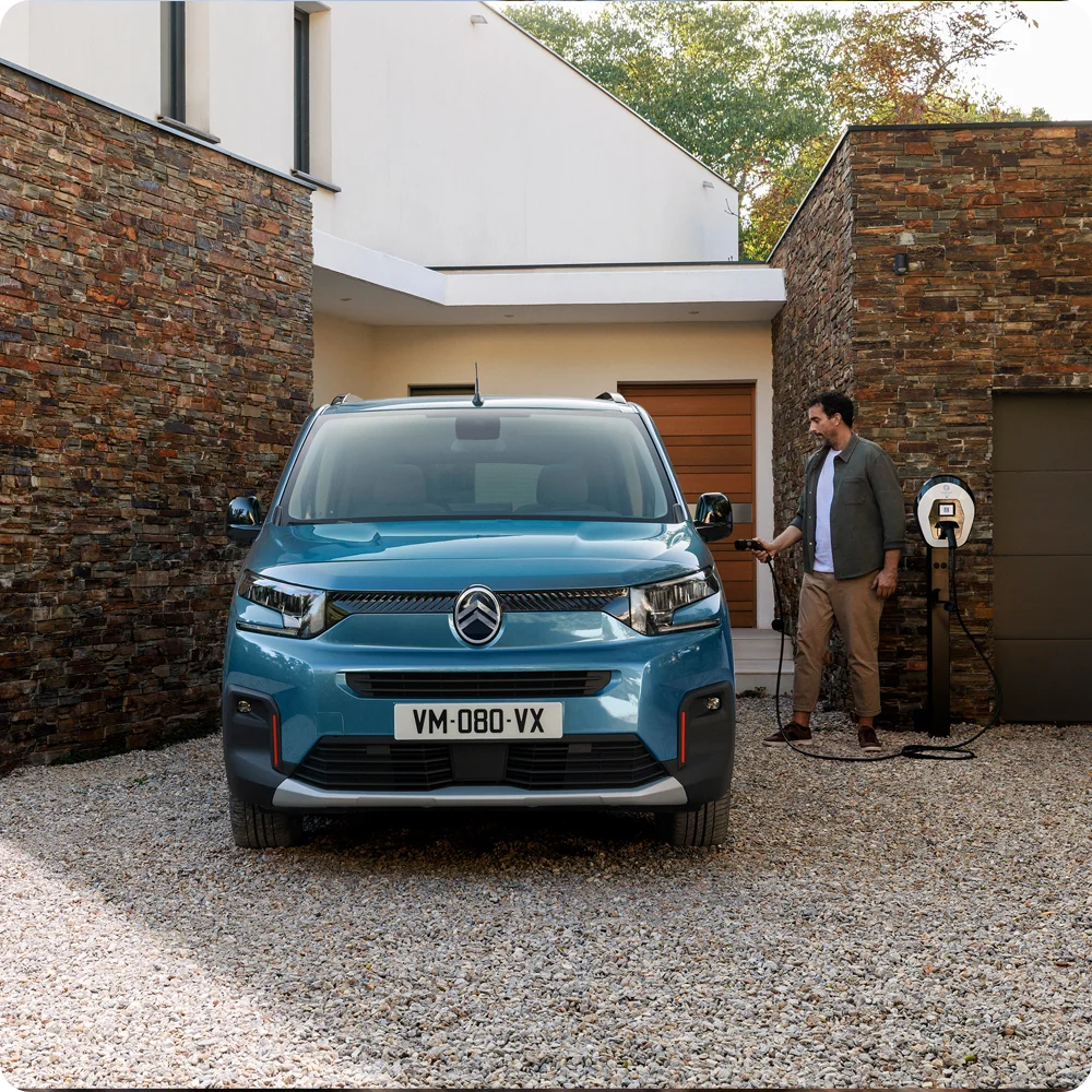 Front view Kiama Blue ë‑Berlingo charging at home showing safety, efficiency, technology and confident everyday electric use