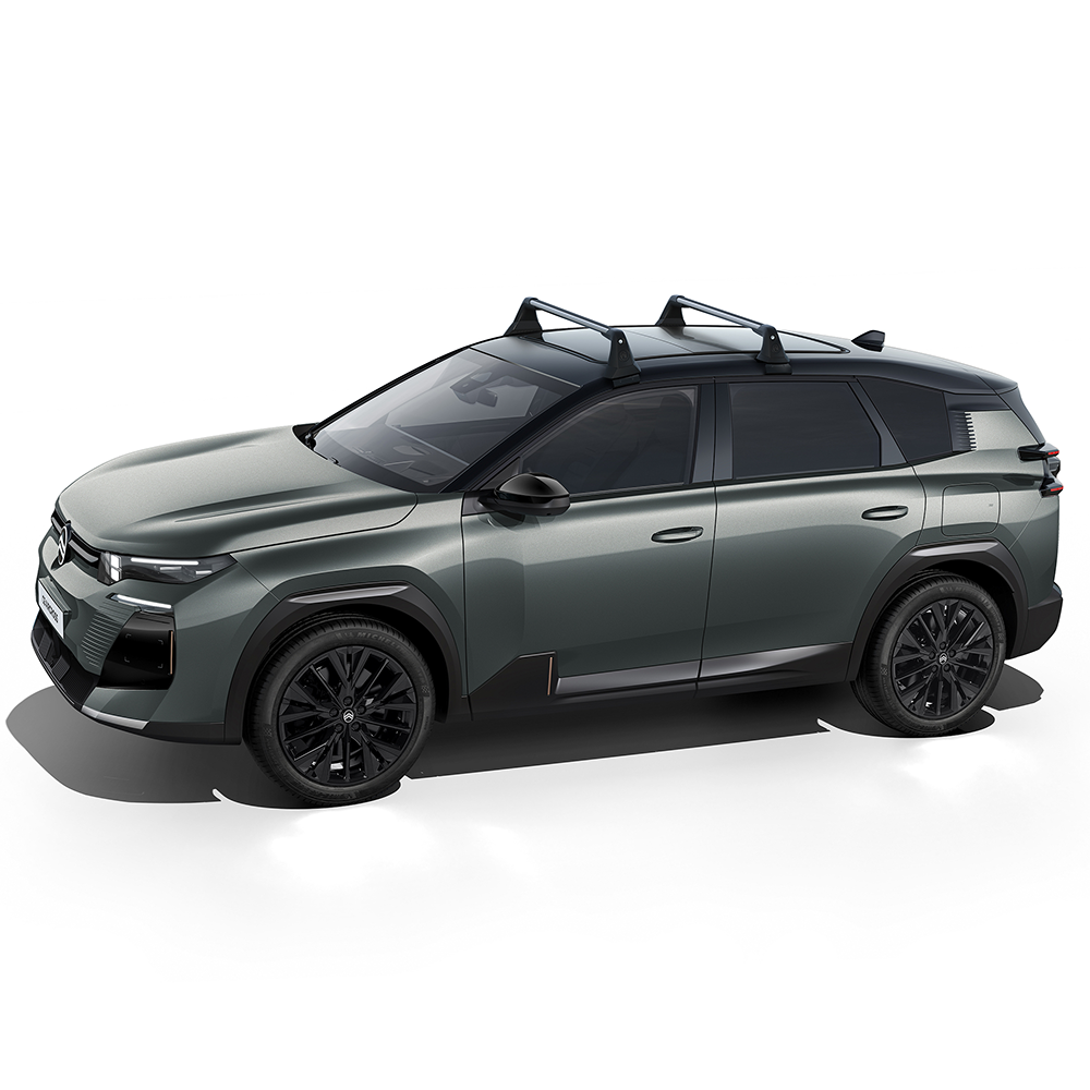 Vue latérale de la ë-C5 Aircross équipée de barres de toit, illustrant une capacité de chargement accrue pour les voyages et le transport d’équipements.